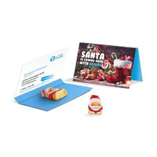 Bigliettino pubblicitario con cioccolatino a forma di Babbo Natale